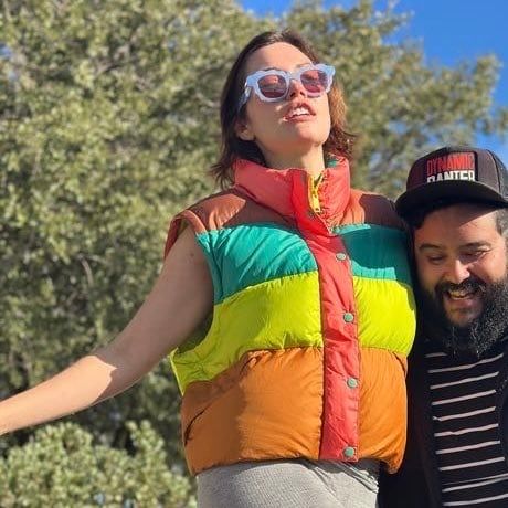 Whitney Moore and Steve Zaragoza smiling together outdoors